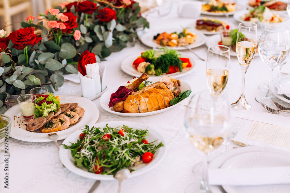 tables setting at a luxury wedding hall. table for guests. dishe tables setting at a luxury wedding hall. table for guests. dishe