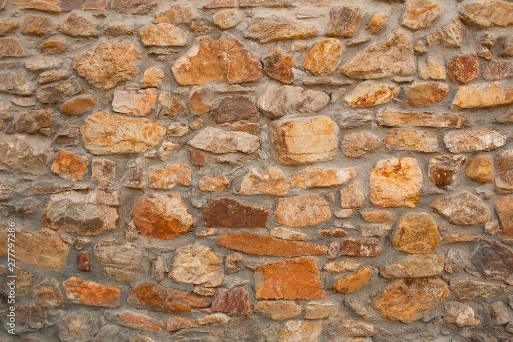 Background, material, texture of a natural stone facade Background, material, texture of a natural stone facade