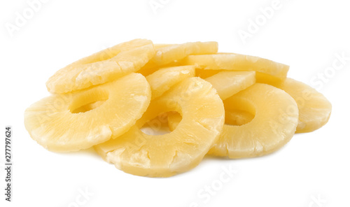 Slices of delicious sweet canned pineapple on white background