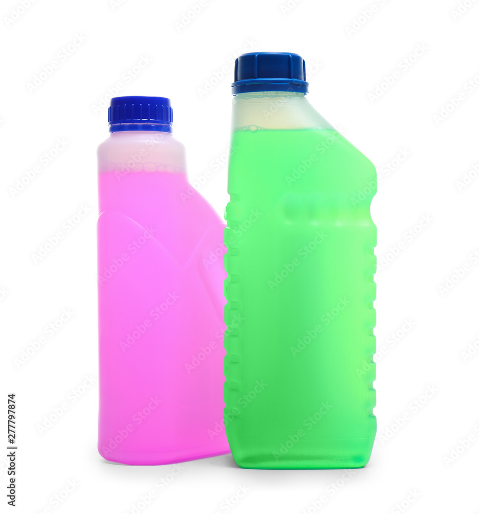 Plastic canisters with different liquids for car on white background Plastic canisters with different liquids for car on white background