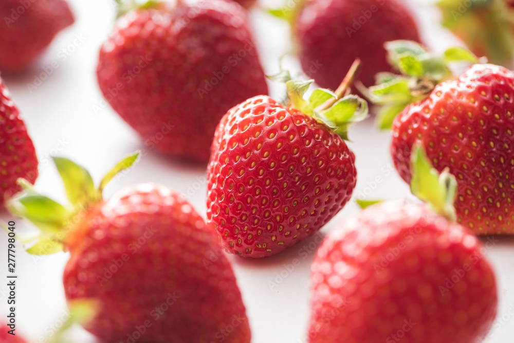 selective focus of ripe and sweet strawberries on white background selective focus of ripe and sweet strawberries on white background