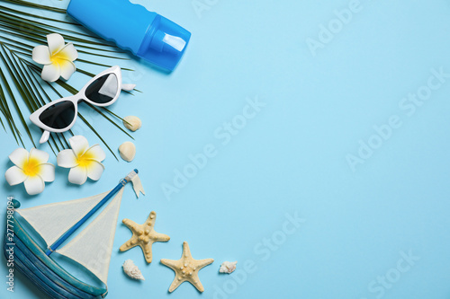 Flat lay composition with beach accessories on color background  space for text