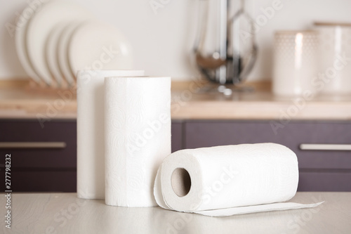 Rolls of paper towels on table in kitchen