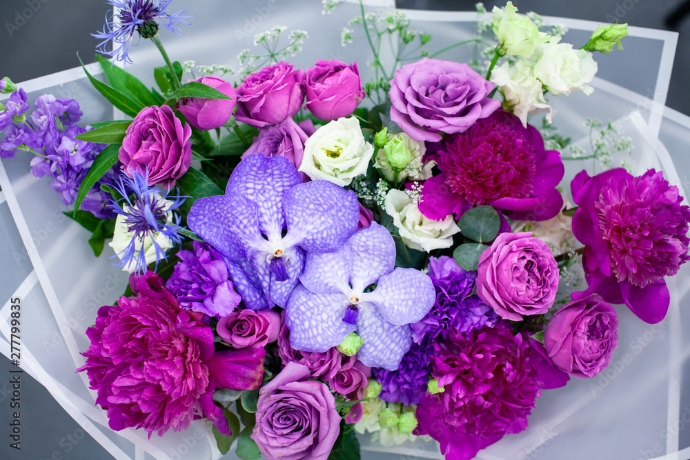 Close up of beautiful flower bouquet and floral decorations. Floristics workshop. Flowers background..