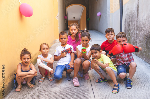 group of little boys of different ages having fun and playing together