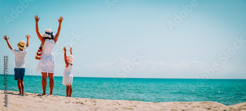 happy family -mother with son and daughter-enjoy beach