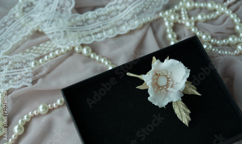 Wedding background with pearls and hair accessories on pink background