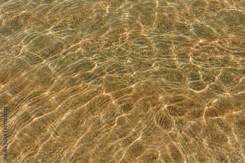 Background of the Red sea water surface and sandy bottom Background of the Red sea water surface and sandy bottom