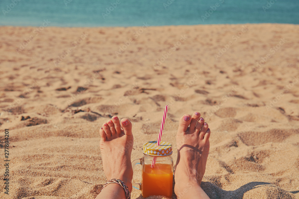 Woman lying down on the beach. Summer concept. Woman lying down on the beach. Summer concept.