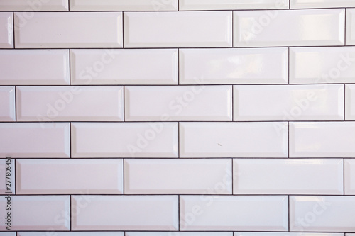 white brick wall of tiles