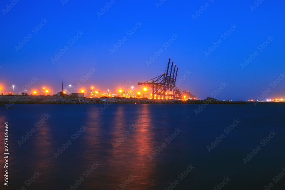 Cranes at the cargo terminal in the evening