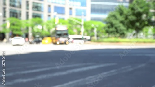 Blurred Columbus Circle Traffic video background, yellow cabs, cars, cyclists and public transport shot on a sunny morning in New York near Central Park