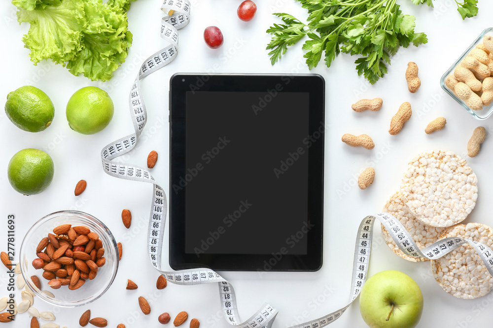 Tablet computer on workplace of nutritionist Tablet computer on workplace of nutritionist