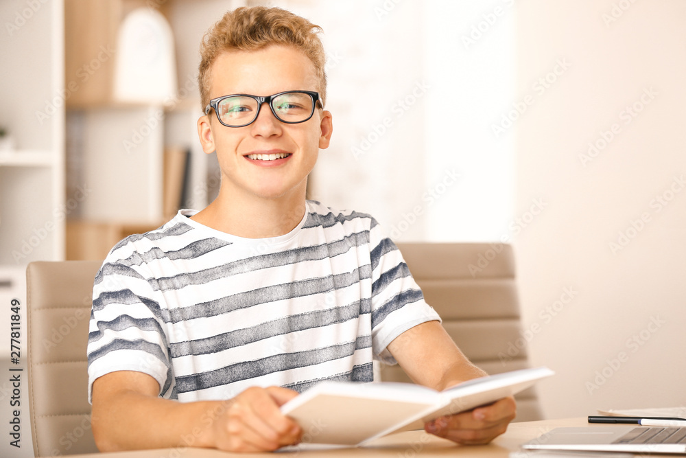 Male student preparing for exam in university Male student preparing for exam in university