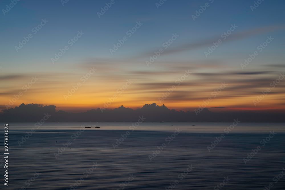 Beautiful seascape with boat in the sea at sunset or sunrise. Natural light background.