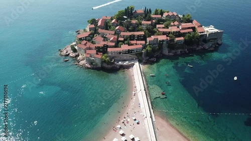 Aerial view of drone flying over island of the Sveti Stefan in Montenegro, Balkans nearby Adriatic sea.
