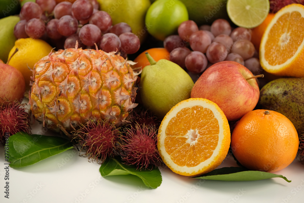 A heap of different tropical fruits isolated on white background. Healthy and organic fair concept. - Image A heap of different tropical fruits isolated on white background. Healthy and organic fair concept. - Image
