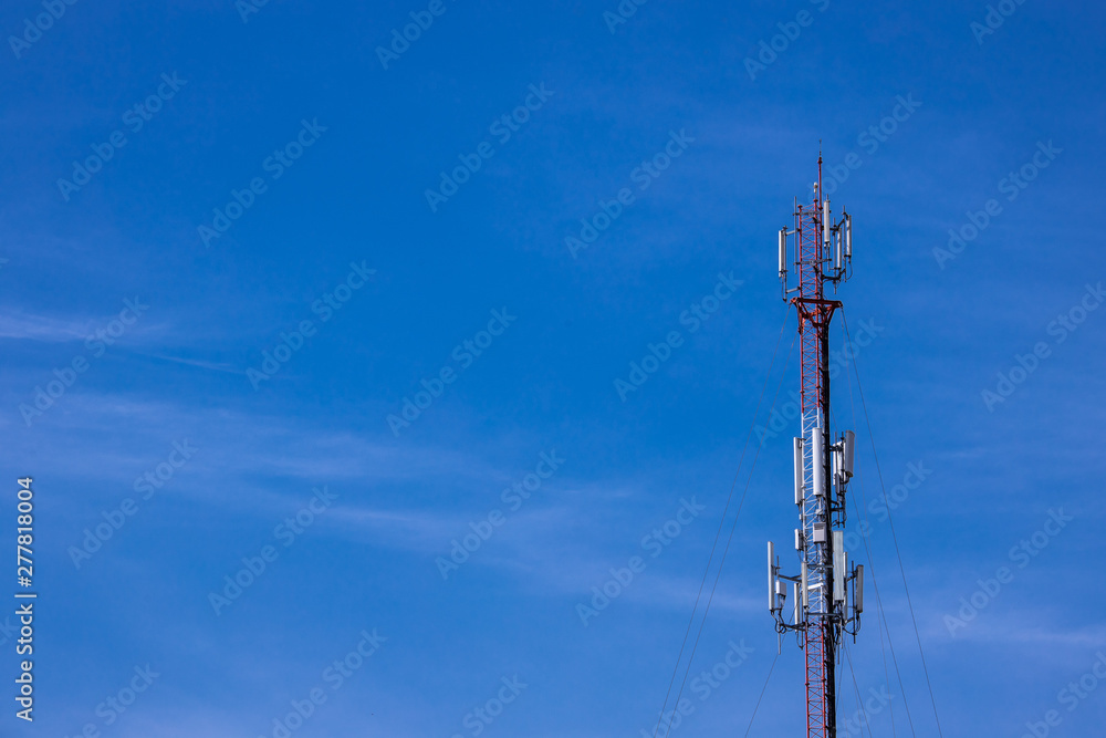 Communication antenna phones tower on blue sky