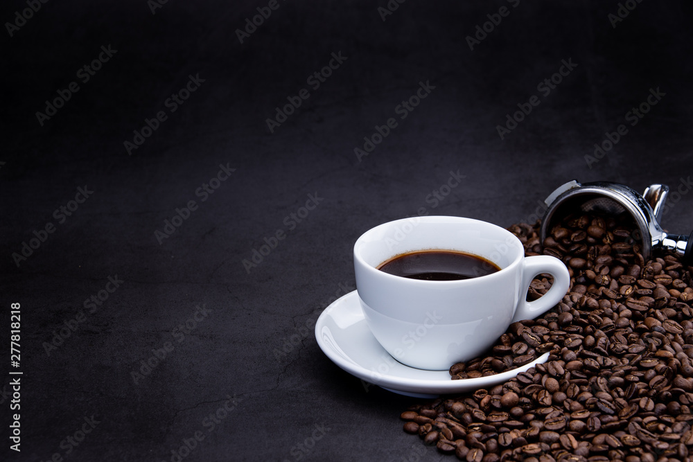 cup of coffee with beans and coffee machine on black background cup of coffee with beans and coffee machine on black background