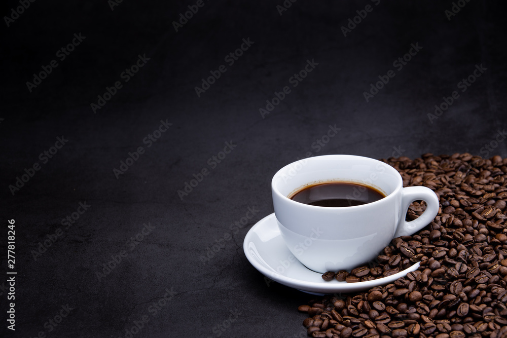 cup of coffee with beans on wooden background cup of coffee with beans on wooden background