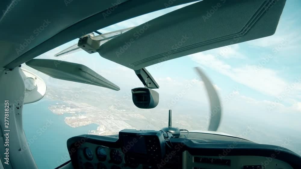 POV of copilot view of coast city from airplane cockpit 4K POV of copilot view of coast city from airplane cockpit 4K