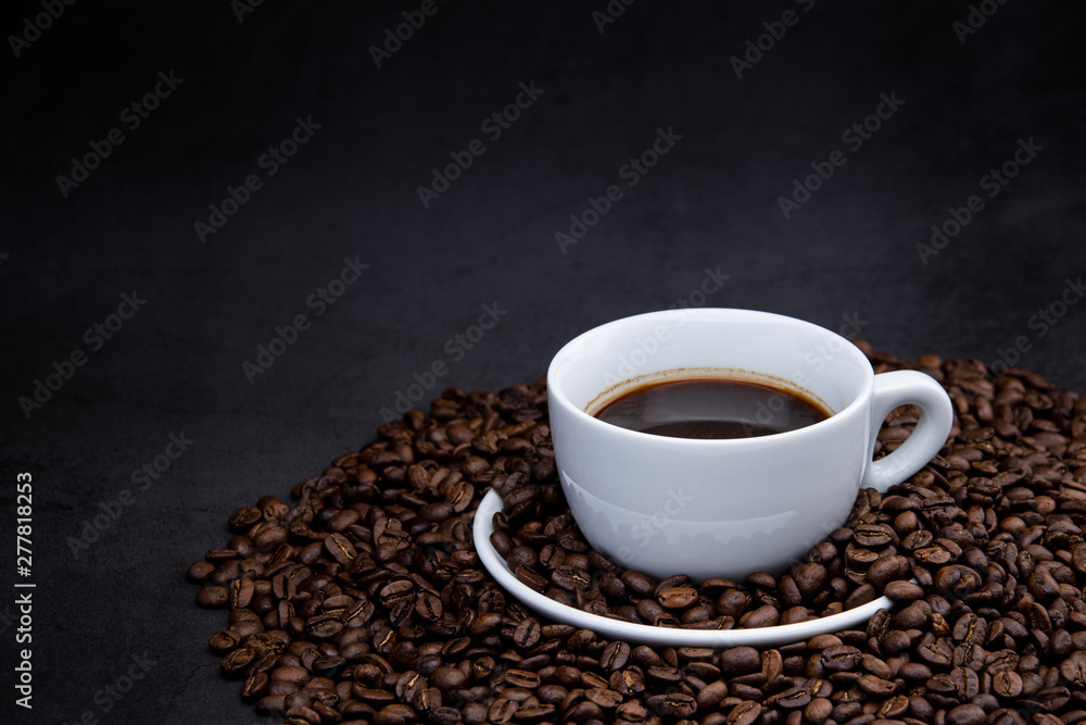 cup of coffee with beans on wooden background cup of coffee with beans on wooden background