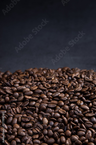 coffee beans on a black background © Sitthikorn