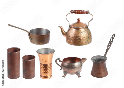 set of antique copper utensils isolated on white background