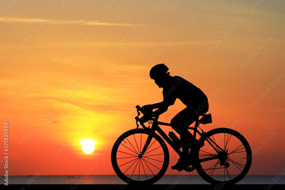 Silhouette Cycling on blurry sunrise sky background. Silhouette Cycling on blurry sunrise sky background.