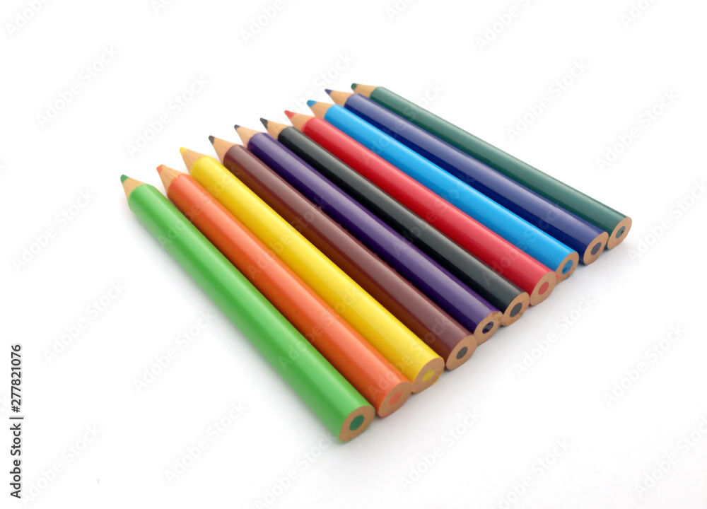 many different colored pencils on a white background. many different colored pencils on a white background.