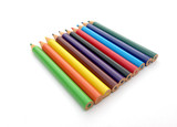 many different colored pencils on a white background.