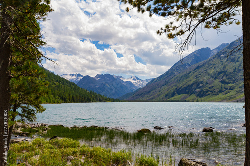 Multinsky lakes in Altai mountains. Beautiful view on snow top. Summer tourist concept.