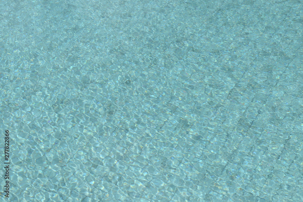 Water in the swimming pool close-up. Natural abstract background