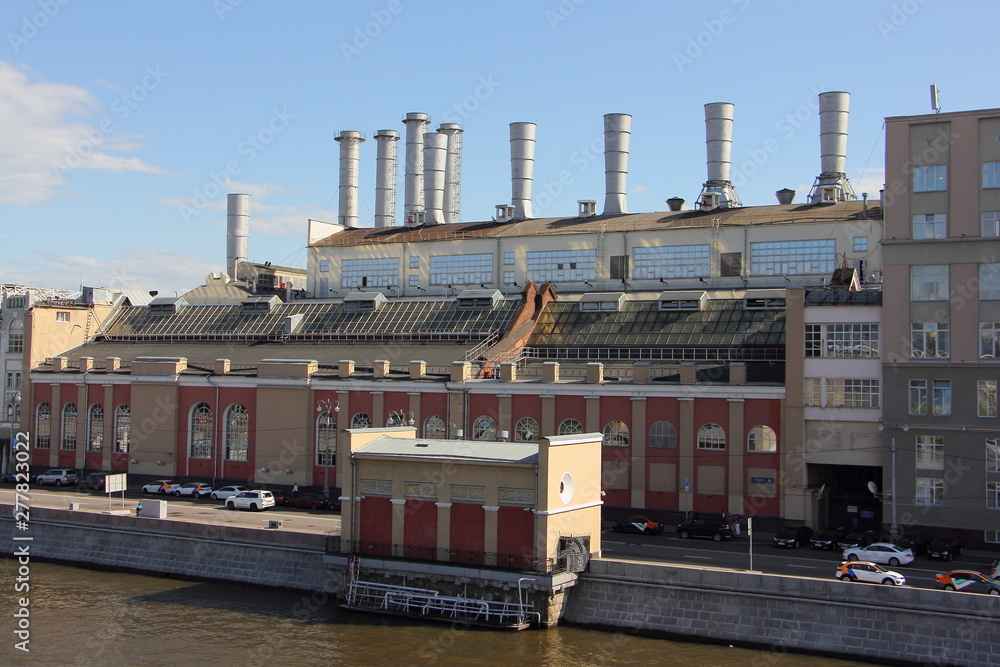 Russia, Moscow, The first Soviet hydroelectric station HPP № 1 on embankment of the Moscow river on a Sunny summer day, the Russian energy industry Russia, Moscow, The first Soviet hydroelectric station HPP № 1 on embankment of the Moscow river on a Sunny summer day, the Russian energy industry