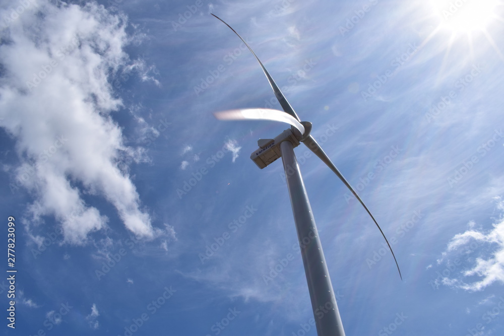 wind turbine against blue sky wind turbine against blue sky