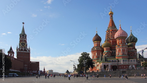 Russia, Moscow, Vasilievsky descent, view of the Spasskaya tower of the Kremlin and St. Basil's Cathedral on a Sunny summer day against the blue sky, Red Square the main city landmark