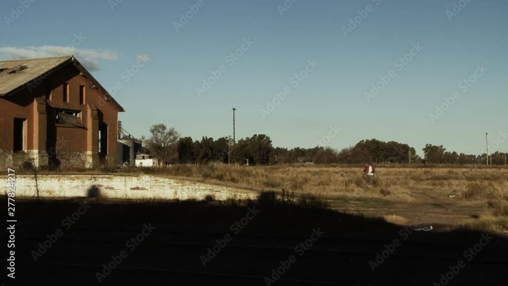 Man on Bicycle in the Old Train Station in Carhué, a small Town of Argentina. Man on Bicycle in the Old Train Station in Carhué, a small Town of Argentina.