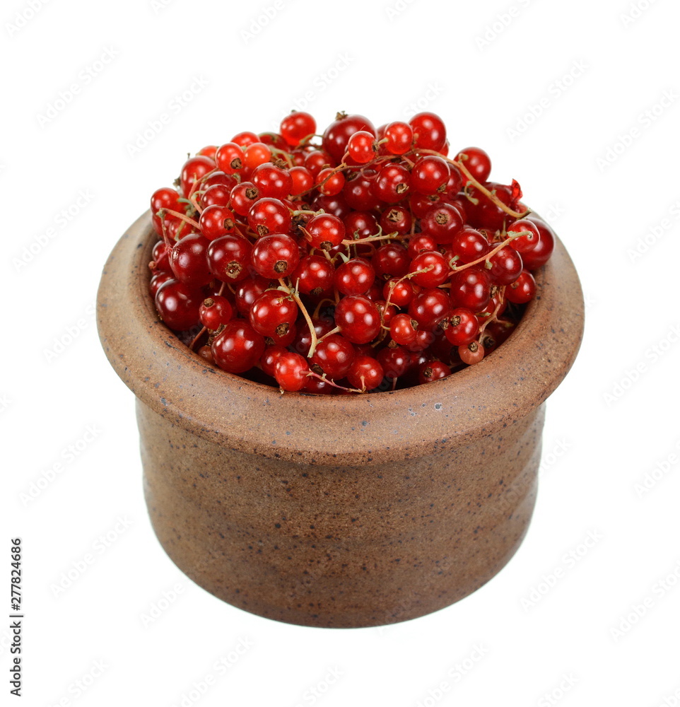 Red currants in a bowl isolated on white background Red currants in a bowl isolated on white background