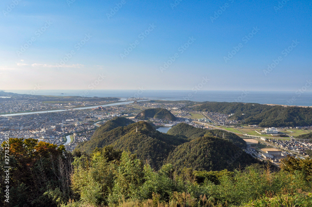 View for Tottori city from Tottori castle in Japan. cityscape, stream and sea.