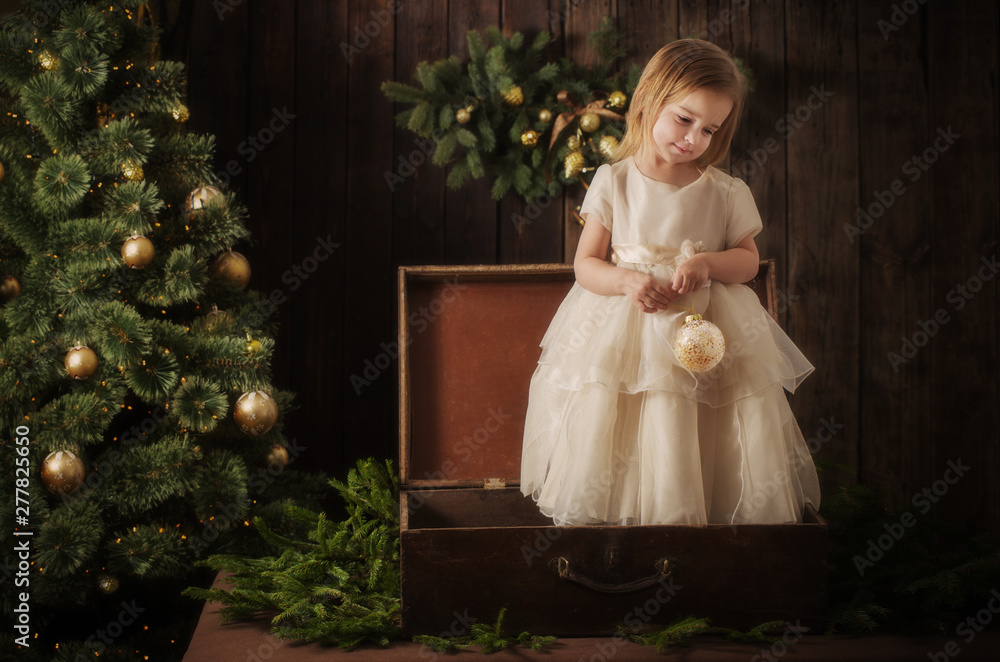 little girl in dress with christmas tree in retro style little girl in dress with christmas tree in retro style