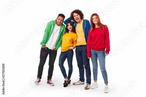 Cheerful multiracial friends posing for camera