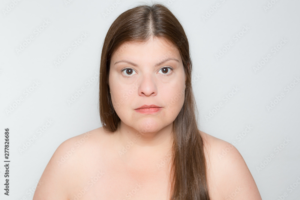 Frontal lighting in studio portrait. Main light in front of face trying to reduce shadows, very common. From a series of portraits that shows the different kinds of lighting setups. Frontal lighting in studio portrait. Main light in front of face trying to reduce shadows, very common. From a series of portraits that shows the different kinds of lighting setups.
