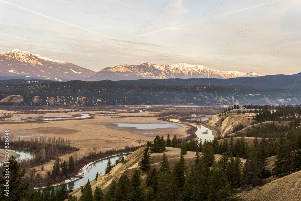 early spring morning at columbia river valleynear Radium Hot Springs with rocky mountains on the background.