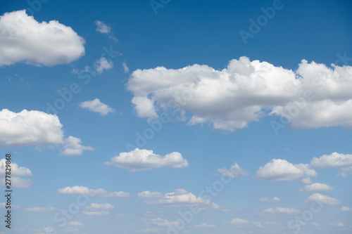 Bright beautiful blue sky with clouds for background or texture