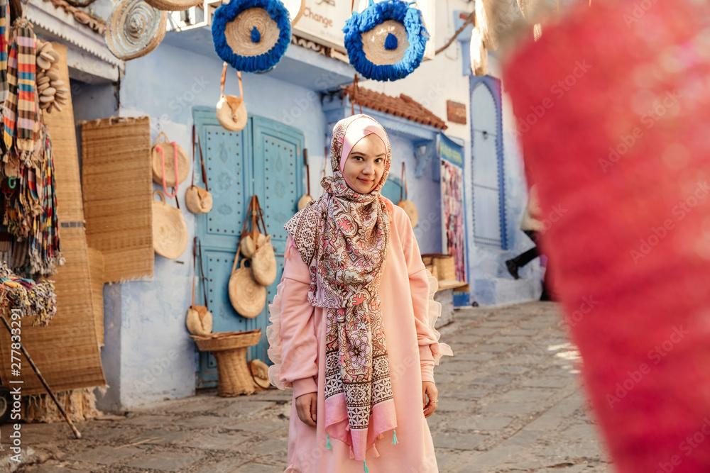 Fototapeta premium Tourist on a street with souvenirs - Chefchaouen, Morocco