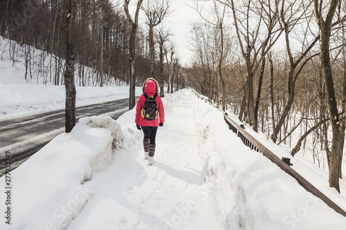 Travelers refuse to travel from public cars and have a strong determination to walk to the peaks of furano hokkaido in order to get as much as possible with nature during the holidays. photo