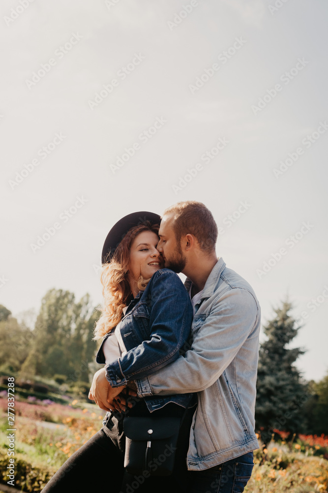 Happy loving couple outdoor in park .