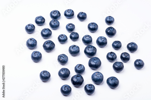 Group of blueberries on white background © Tomasz Pawluś