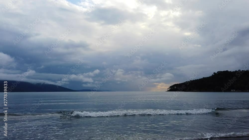 A view from the Aegean Sea showing the silhouette of Akyaka shoreline (Gulf of Gokova) on an overcast spring afternoon. Shot and presented at 60 fps. A view from the Aegean Sea showing the silhouette of Akyaka shoreline (Gulf of Gokova) on an overcast spring afternoon. Shot and presented at 60 fps.