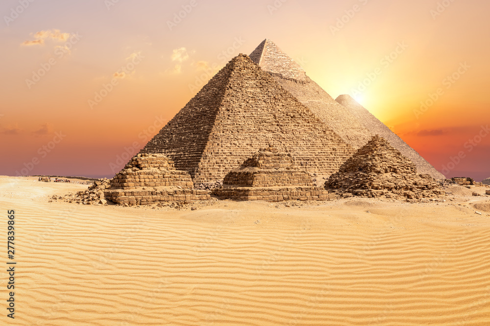 The famous Giza Pyramids in the desert at sunset, Egypt